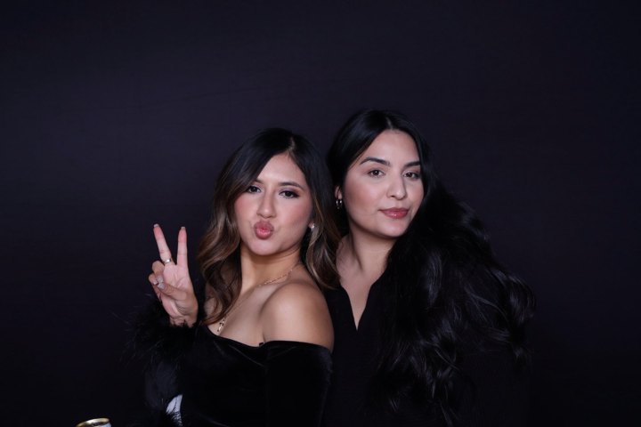 Two guests posing together