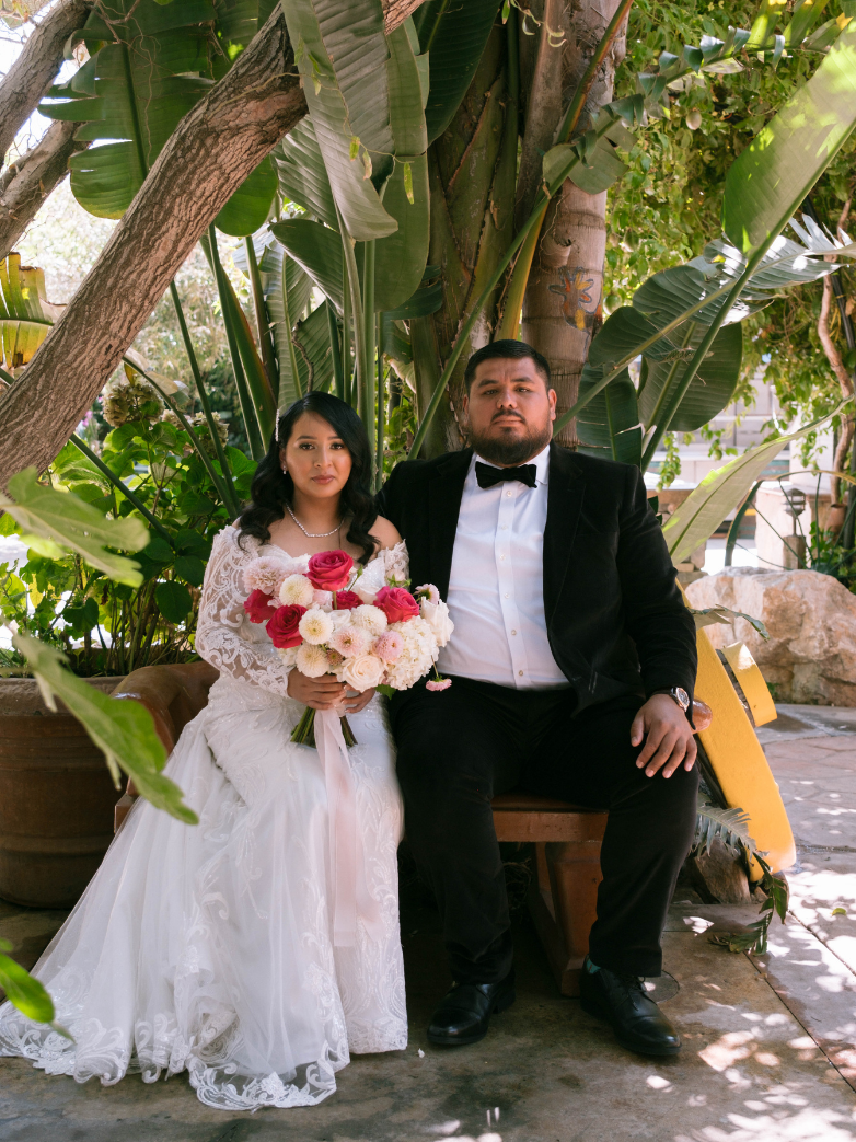 Bride and groom posing with Core Memories Photo Booth setup at a Monterey wedding