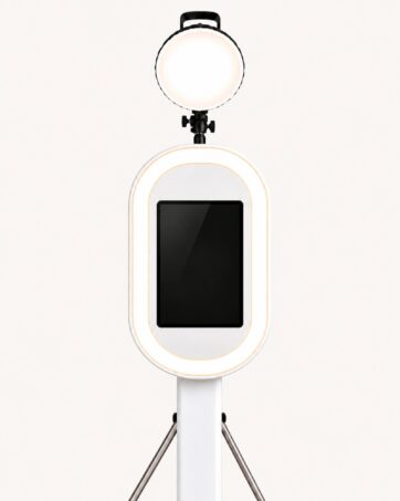 White Digital photo booth with a touchscreen and light on a stand