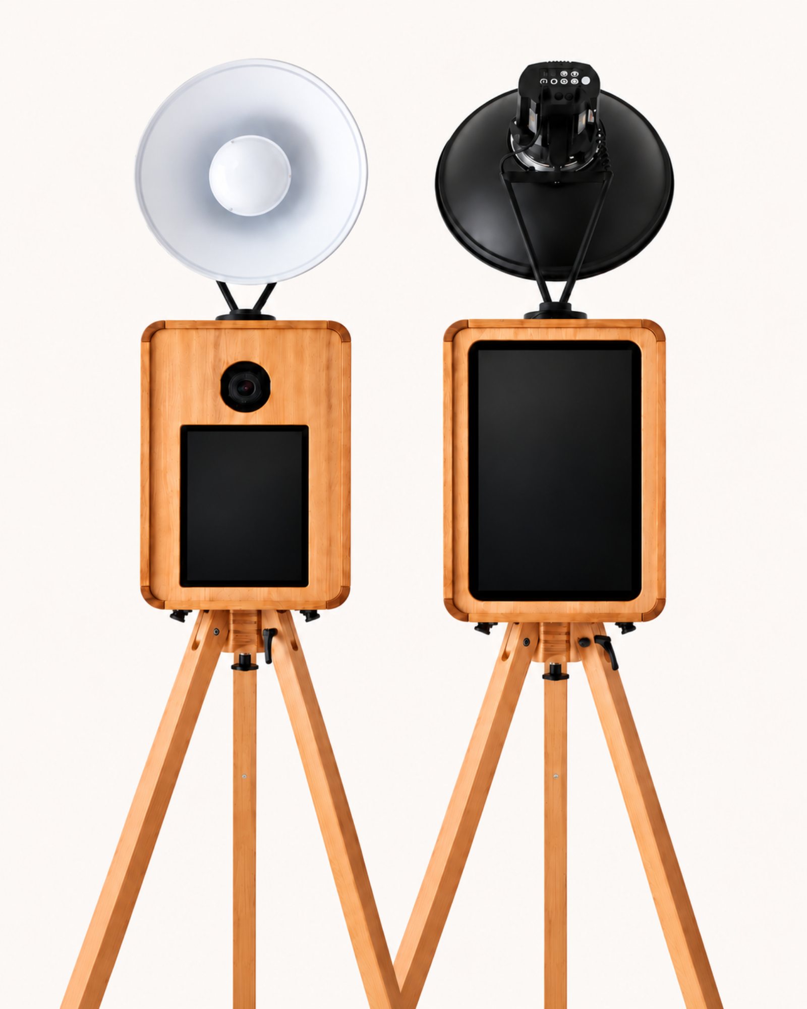 Two wooden Signature photo booth setups with touchscreens and lights